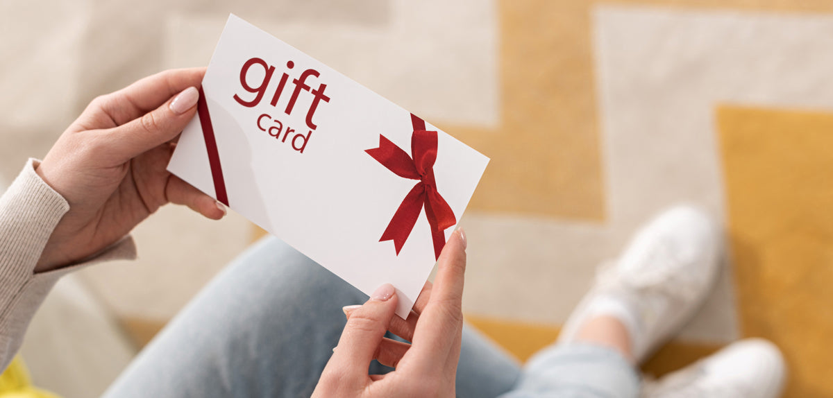 Hands holding a gift card